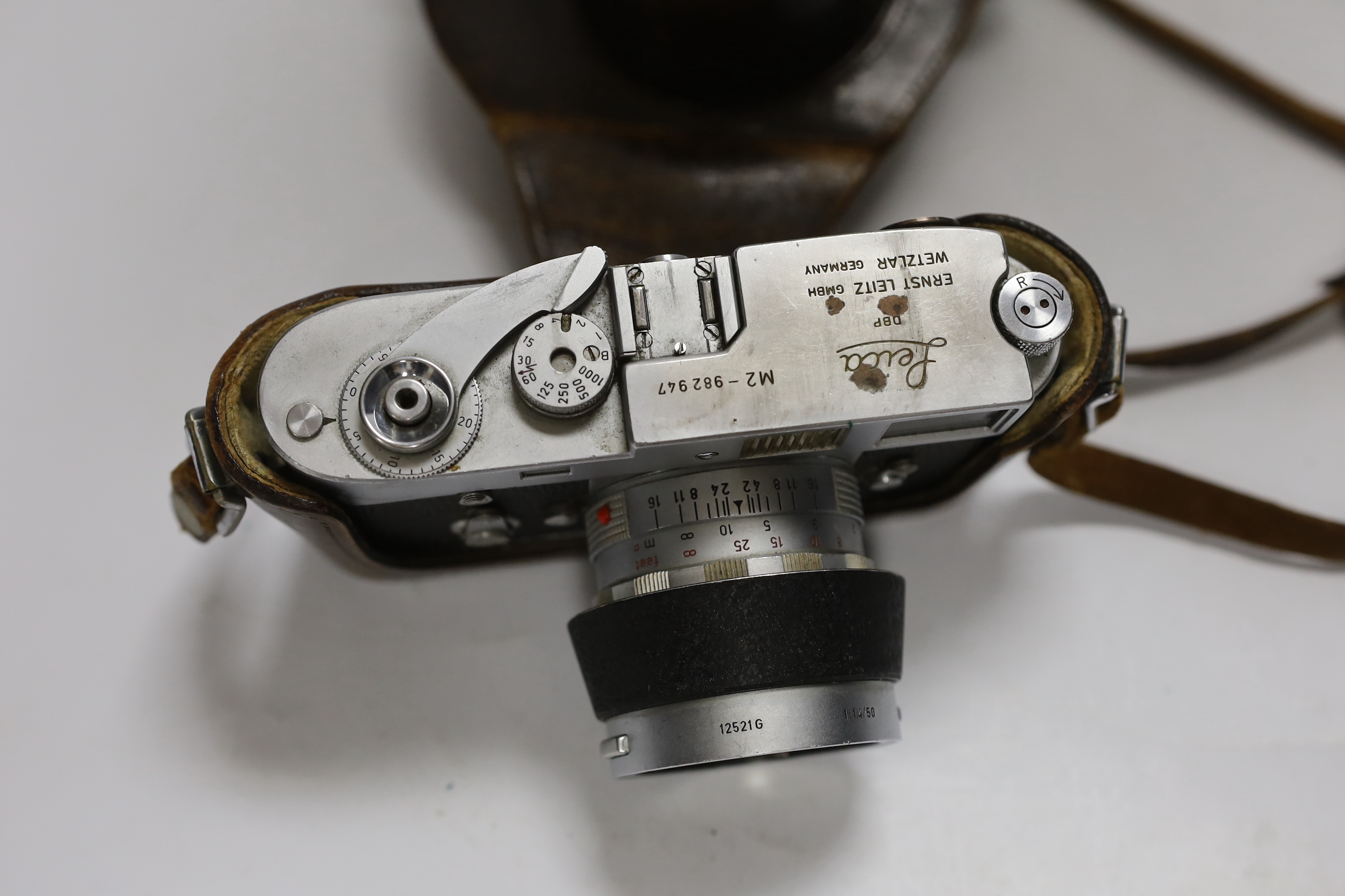 A Leica M2 camera, serial no. 982947, c. 1959, with Summilux 1:1. 4/50 lens, in leather case with strap